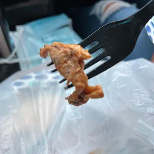 a piece of meat on a fork