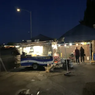 people standing in front of a food truck