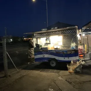 a blue and white food truck