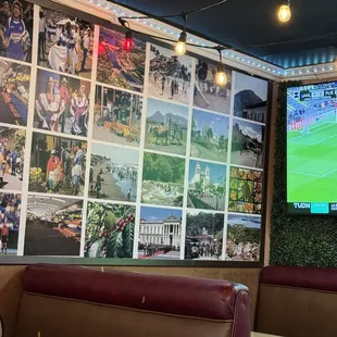 Wall covered with images celebrating El Salvador