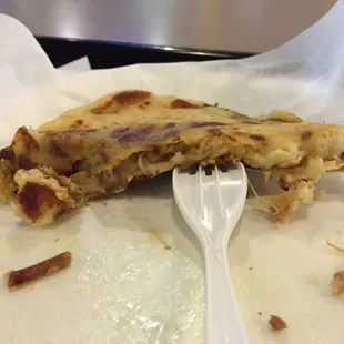 Beef pupusa with bean and cheese. The shell is thin and still crispy