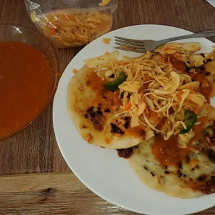 Spinach/cheese pupusas with pickled cabbage and tomato sauce. Delicious!!