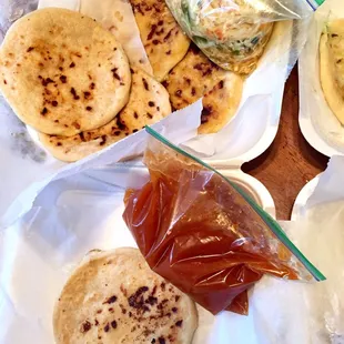 Bottom garlic pupusa, top chicken and pork