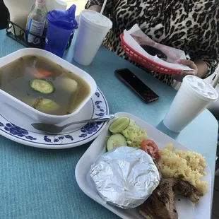 Caldo de Gallina, veggie and chicken soup, is served with choice of tortillas, rice, salad &amp; a piece of  chicken