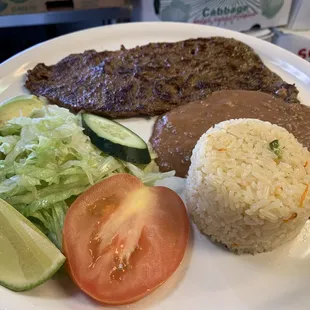 Steak with salad,rice and beans