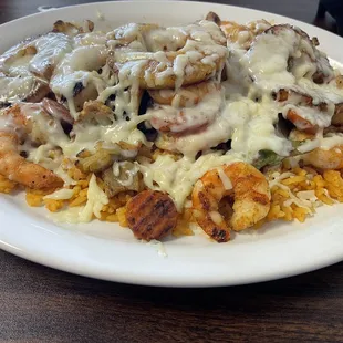 Camaron Tropical  Shrimp with pineapple, steamed mixed vegetables, Monterrey cheese, and served with rice