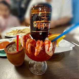 Cabaña michelada with a cantarito