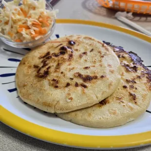 2 pupusas and cabbage slaw