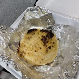 a tortilla wrapped in foil