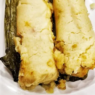Chicken tamales made in banana leaves