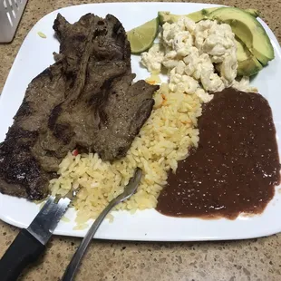 Carne Asada with rice, beans, and macaroni salad