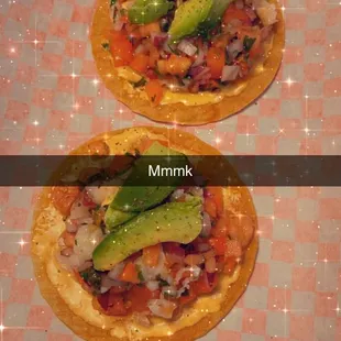 two small pizzas on a tray