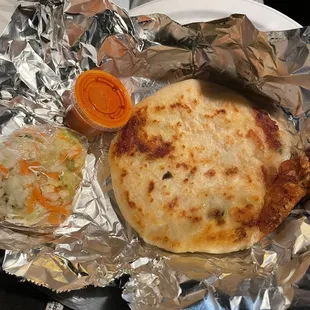 Pupusa, pickled vegetables, hot sauce