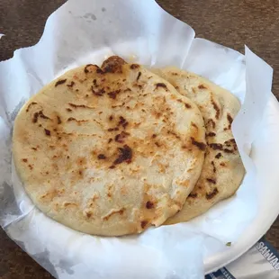 two tortillas on a paper plate