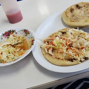 two plates of food and a drink