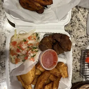 Chicharones, yucca, salad, sauce, and a side of sweet plantains :)