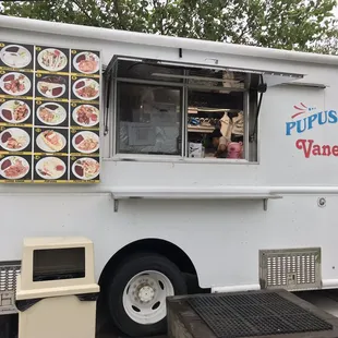 a food truck with plates of food