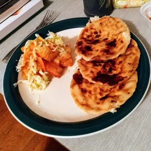 Cheese pupusas with a side of yuca fritas.
