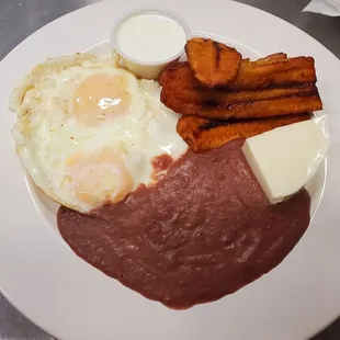 Desayuno Typico  beans. eggs. fresh made cheese. plantains. &amp; 2 pupusas.