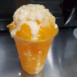 Minuta Salvadorian take on shaved Ice with different flavors and condensed milk and shaved coconut as topping.