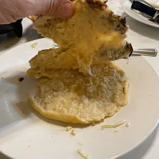 I've been here twice.  My pork papusa had nothing inside except burnt marks.