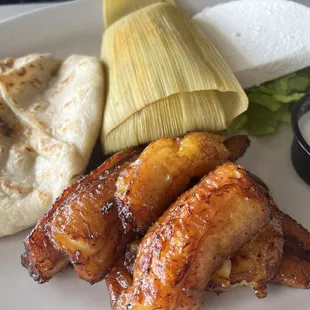 #7. One Pupusa, Plantain with fresh cheese, Sour Cream and Corn Tamale Lunch Special