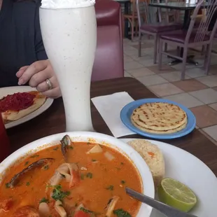 The mariscada was amazing. Soooo much flavor. The Leche con banana was really refreshing.