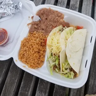 a meal in a styrofoam container