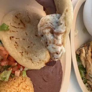 Pupusa lunch plate. 1 bean and cheese 1 loroco and cheese. Side of rice and beans. The pupusas are So good. Cheese was nice and hot.