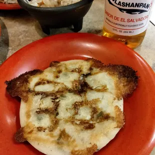 a plate of food and a beer