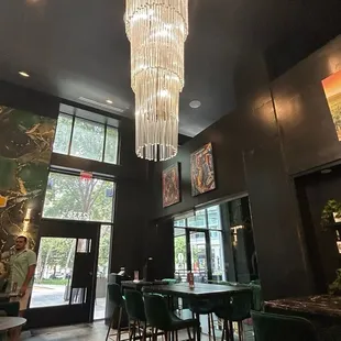 The view of the main seating area and entrance with the amazing chandelier.