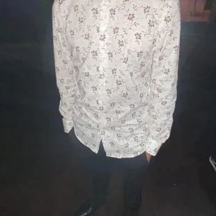 a man in a white shirt and black pants