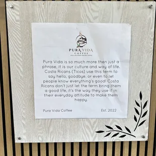 a sign on the door of pura vida coffeehouse