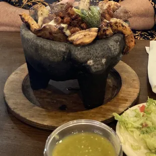 Molcajete chignon volcanic stone filled with meats cool