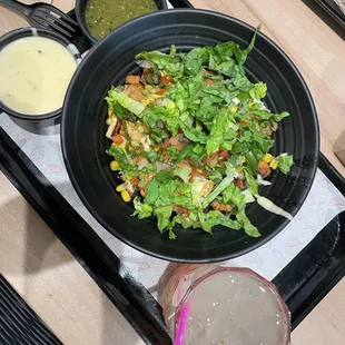 a plate of salad and a drink