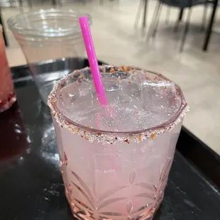 a pink drink with a pink straw