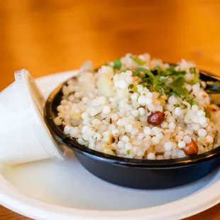 a bowl of rice with a spoon
