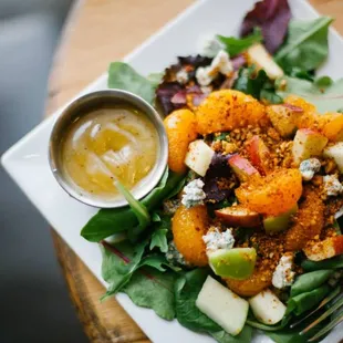 The Baby Bleu Salad: Bed of fresh organic greens topped with bleu cheese crumbles, mandarin oranges, fresh apples, candied pecan