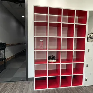 Inside , entryway into studio, Open Cubicle space for items, watched over by desk attendee