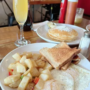 Homestyle potatoes, eggs over easy, toast and pancakes