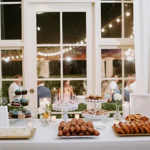 a table with a variety of desserts