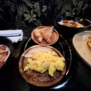Scrambled eggs with cheese and white toast.