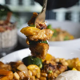 Kung Pao Chicken. Chicken, zucchini, peppers, onions &amp; peanuts sauteed in a homemade Kung Pao sauce served with jasmine white rice.