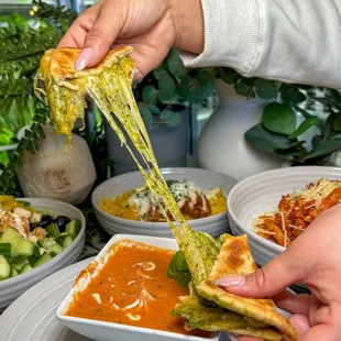 Tomato Basil Soup with a side of whole wheat pita bread grilled cheese and pesto.