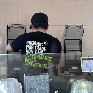 a man working behind a counter