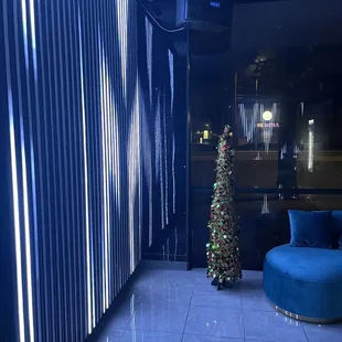 a christmas tree in the corner of a room