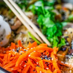 Korean Zoodle Bowl Zucchini and yellow squash noodle, spinach, cashew, PureBlend slaw, cilantro, carrot, gochujang sauce, cashew, daikon rad