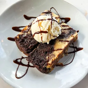 Checkerboard Bread Pudding 
Flourless chocolate cake and gluten free biscuits. House-made vanilla ice cream tops it off .