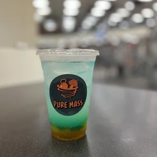 a plastic cup with a drink in it