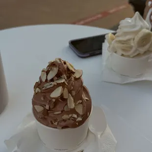 top: butter pecan ice cream with bananas  bottom: chocolate ice cream with almonds